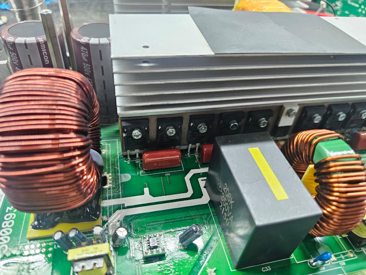 Repaired power inverter board with new components fitted around the MOSFET bank